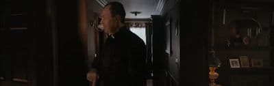 a man standing in a hallway in a house