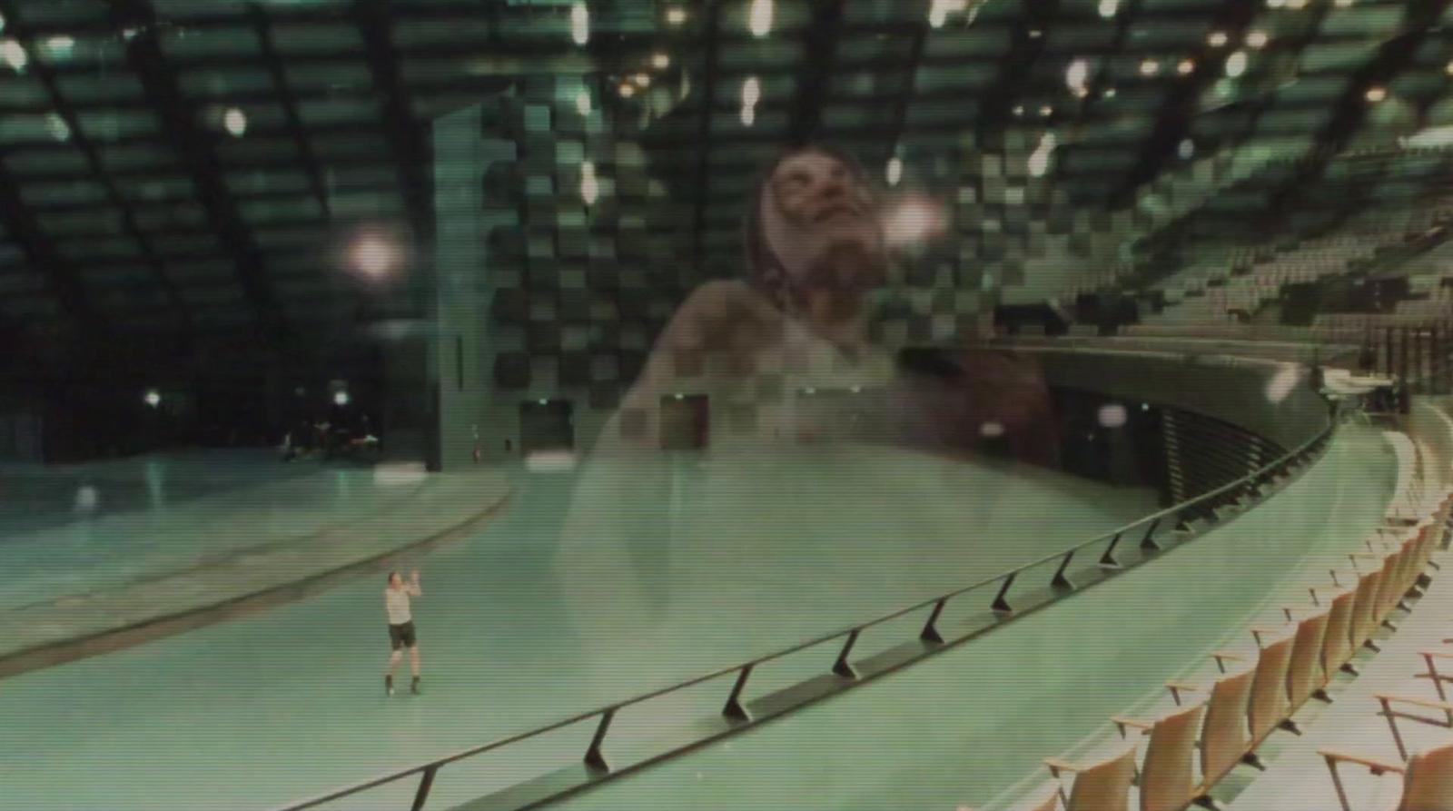 a blurry photo of a person standing on a stage