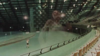 a blurry photo of a person standing on a stage