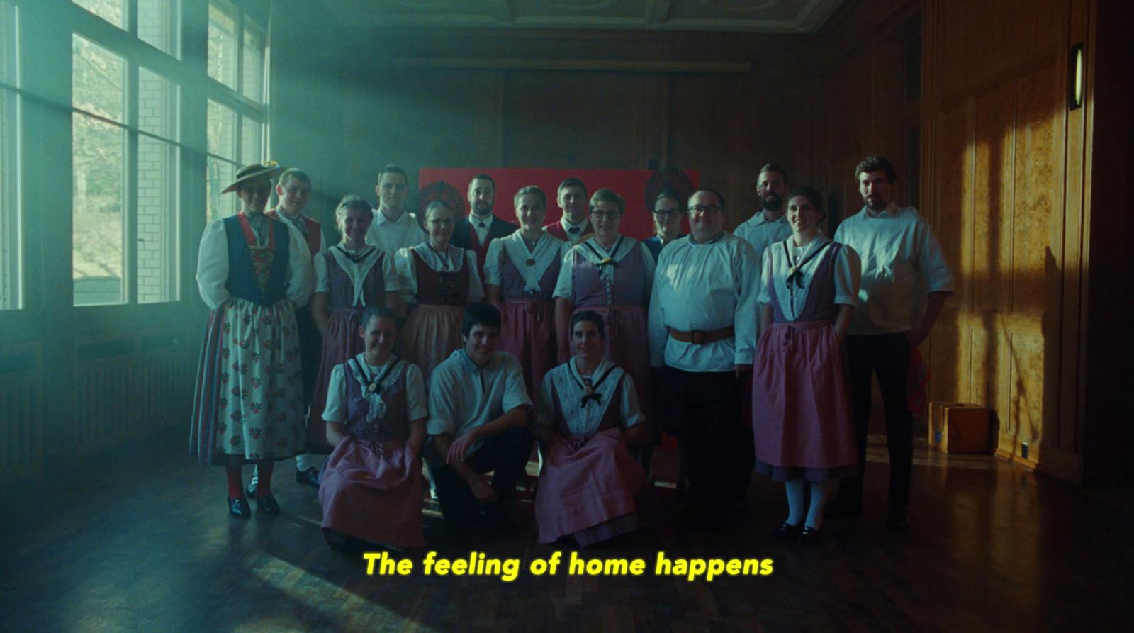 a group of people standing next to each other in a room