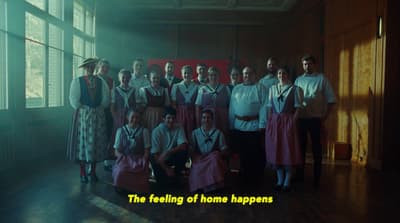 a group of people standing next to each other in a room