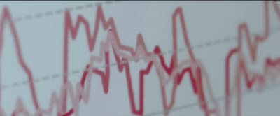 a close up of a red line on a white wall