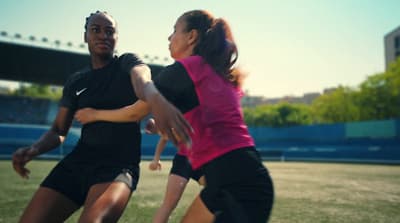 a man and a woman playing a game of frisbee