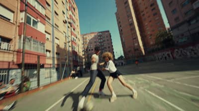 a couple of people that are standing in the street