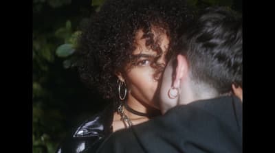 a close up of a person hugging a person