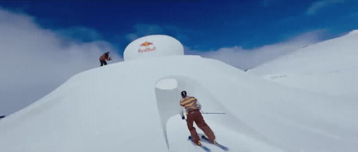 a man riding skis down the side of a snow covered slope