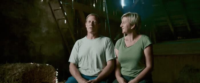 a man and a woman sitting next to each other