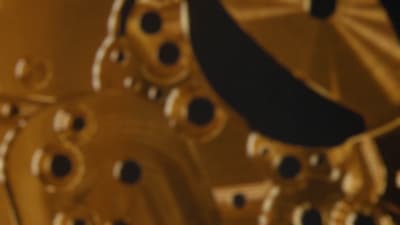 a close up of a metal object with a blurry background