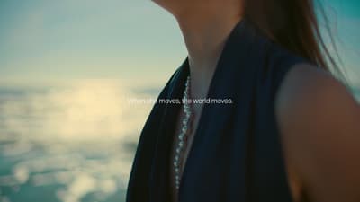 a close up of a person wearing a necklace