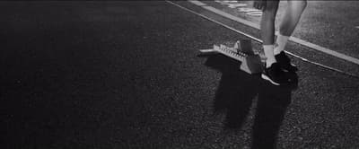 a person riding a skateboard down a street