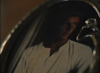 a reflection of a man in a mirror