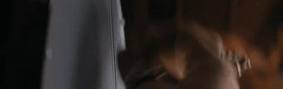 a blurry image of a person standing in front of a mirror