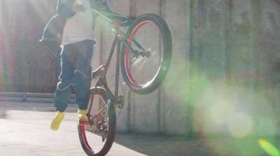 a person jumping a bike in the air