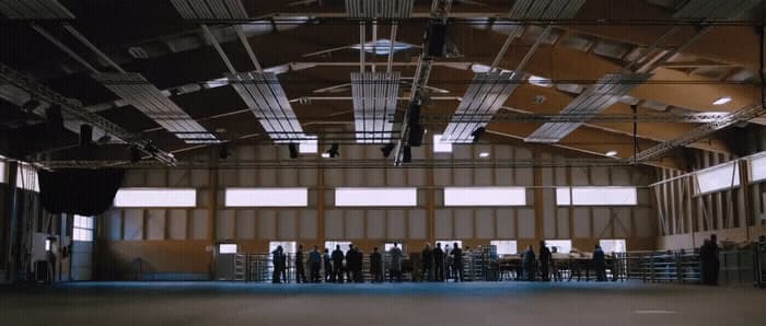 a group of people standing inside of a building