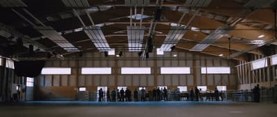 a group of people standing inside of a building