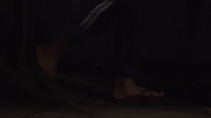 a blurry photo of a person walking in the dark