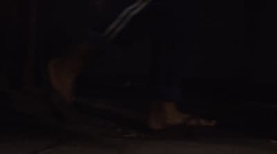 a blurry photo of a person walking in the dark