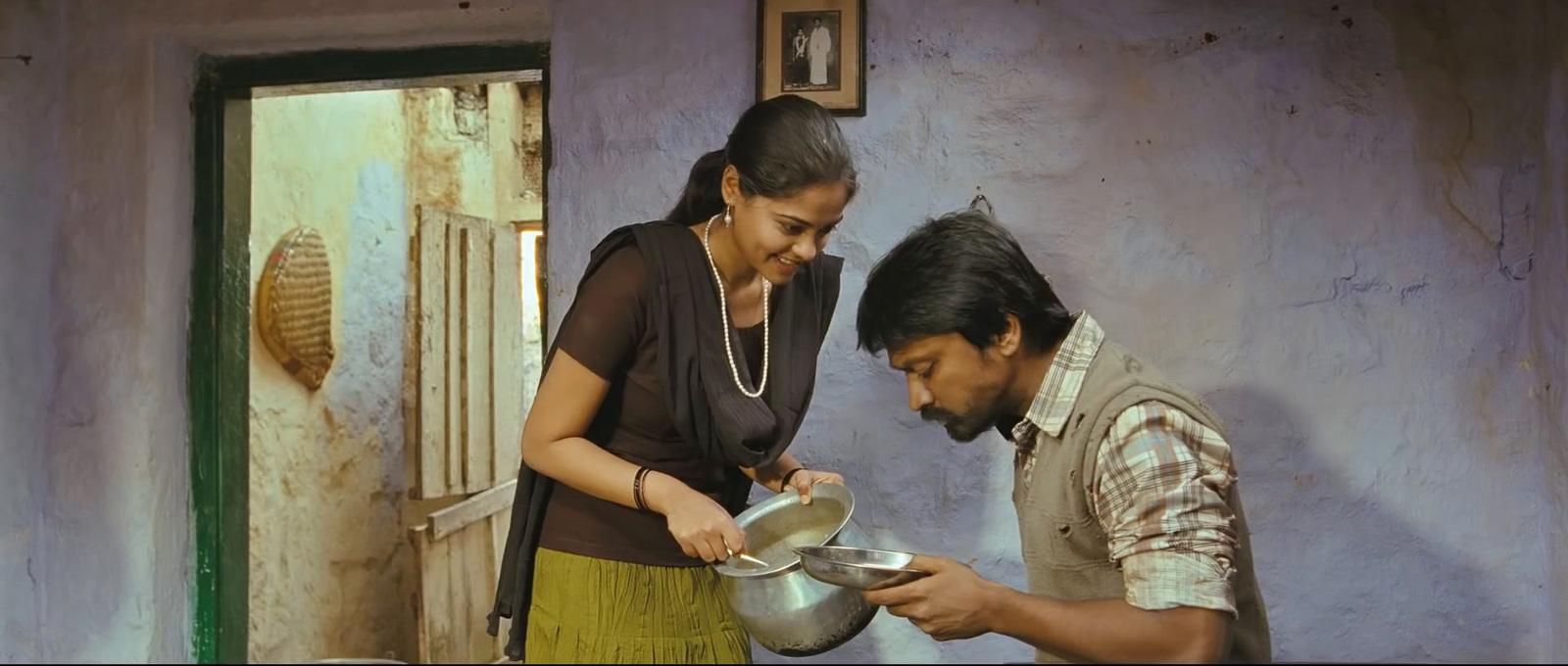 a man standing next to a woman pouring water