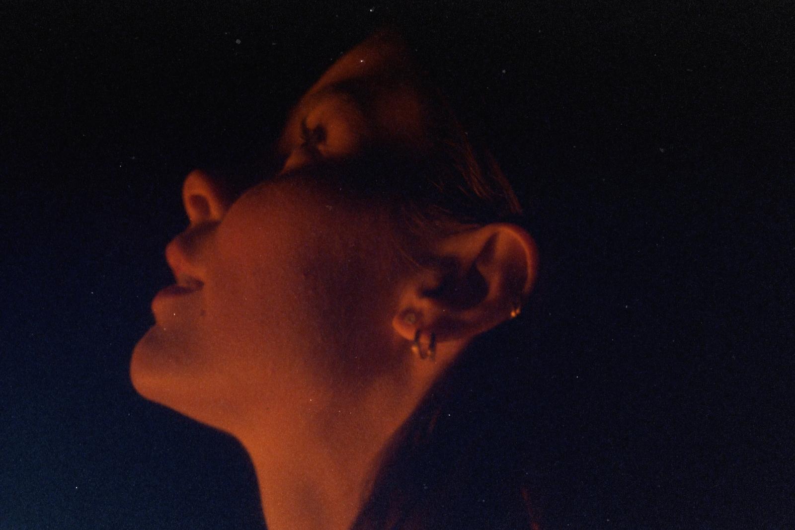 a close up of a person with their eyes closed