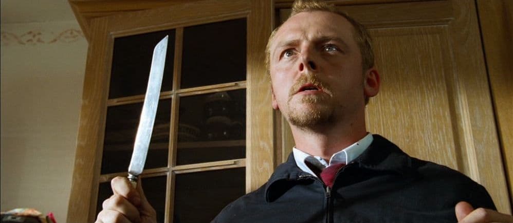 a man holding a knife in his right hand