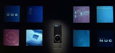 a cell phone sitting on top of a display