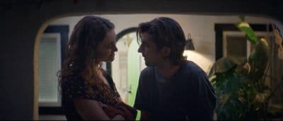 a man and a woman standing next to each other