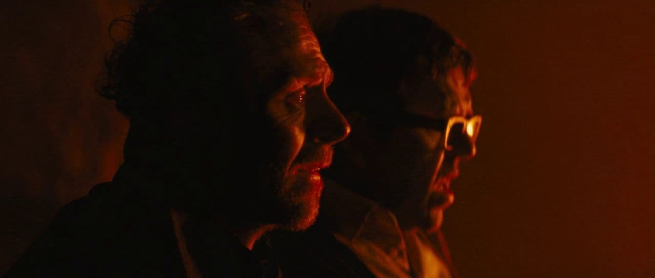 a couple of men standing next to each other