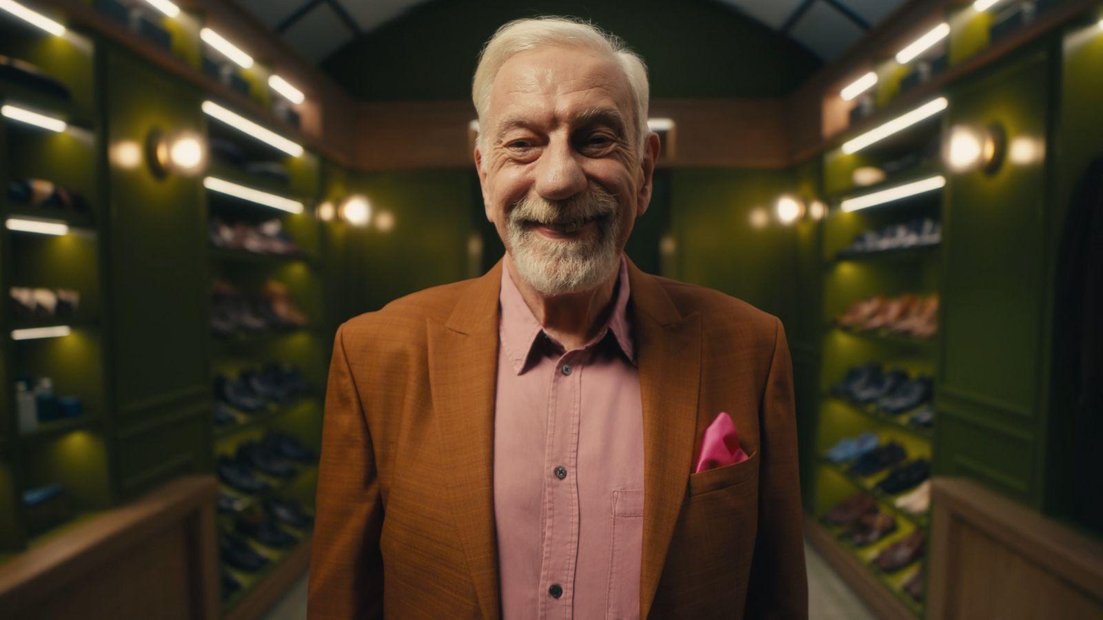 an older man standing in a shoe store