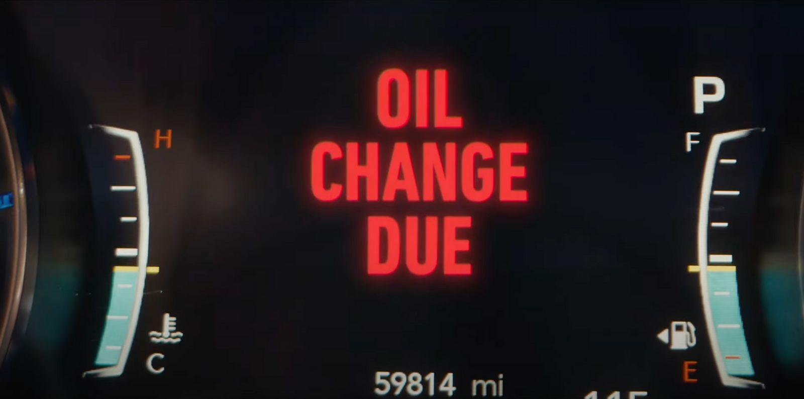a close up of a speedometer with the words oil change due