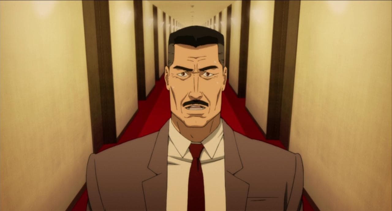 a man in a suit and tie standing in a hallway