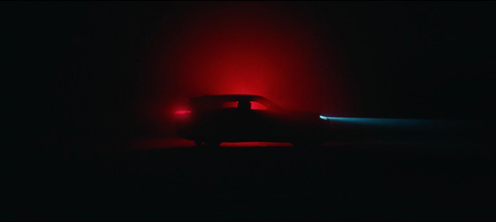 a car in the dark with a red light