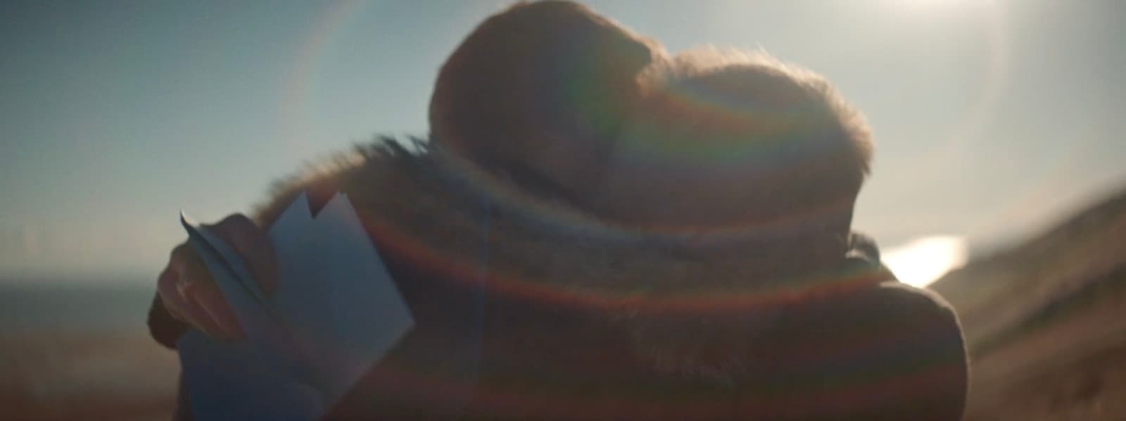 a blurry image of a person reading a book