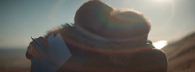 a blurry image of a person reading a book
