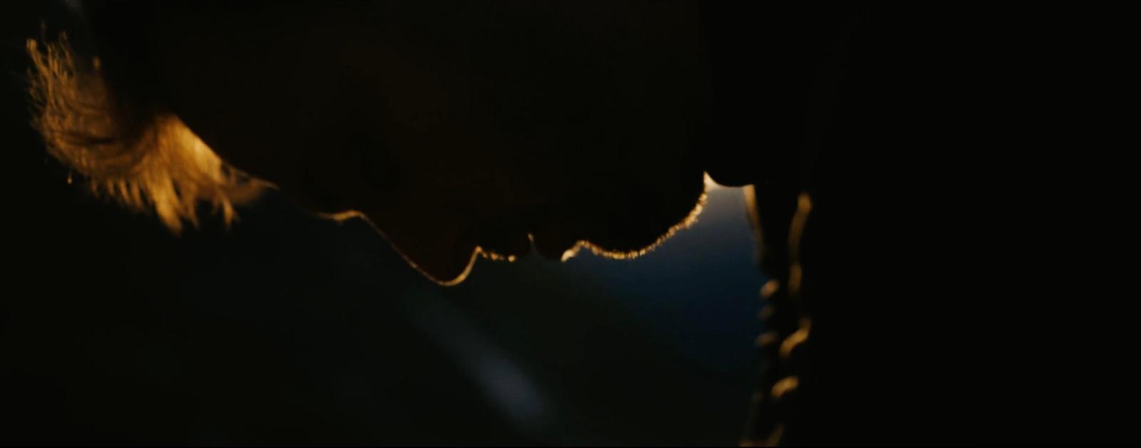 a close up of a person's face in the dark