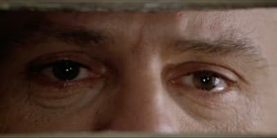 a close up of a person's eye with a blurry background