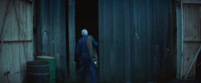 a man standing in a doorway of a building