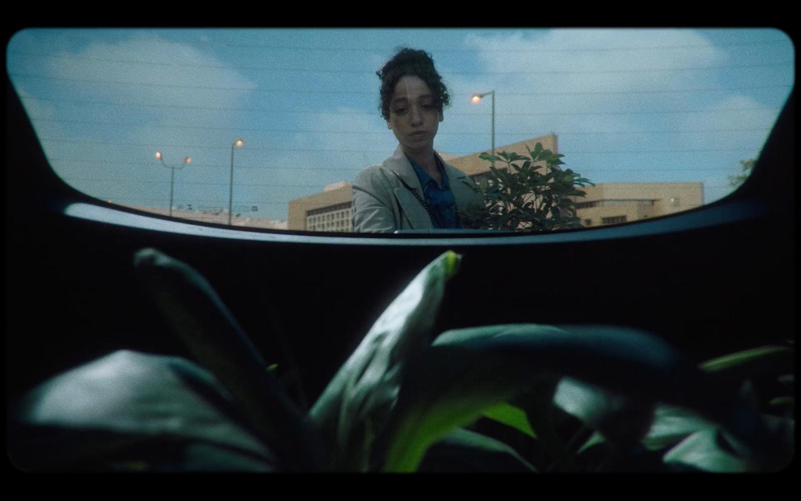 a woman looking out of a car window