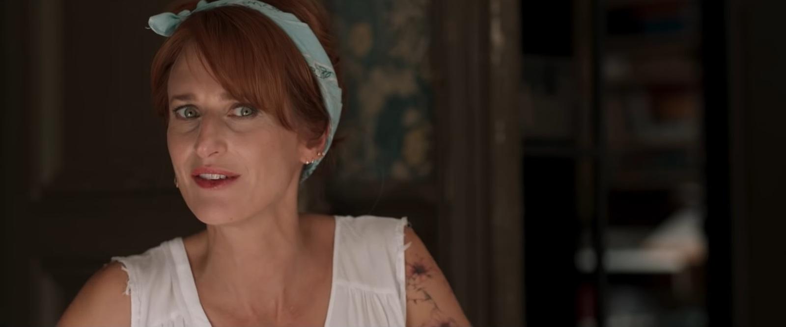 a woman with a blue bow in her hair