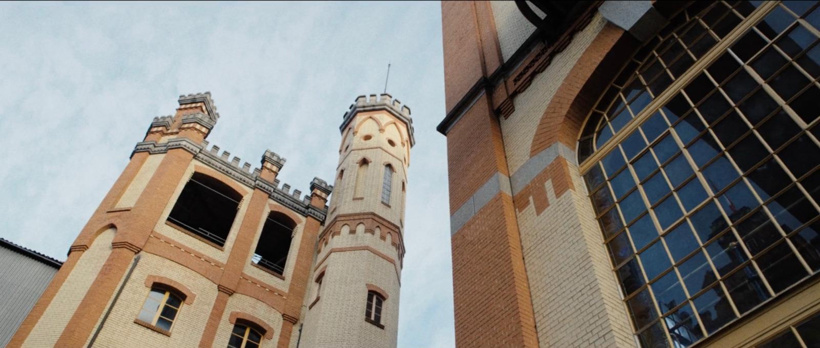 a tall building with a clock on the side of it