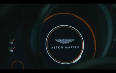a close up of a steering wheel with a logo on it