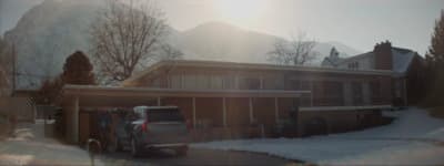 a truck is parked in front of a house
