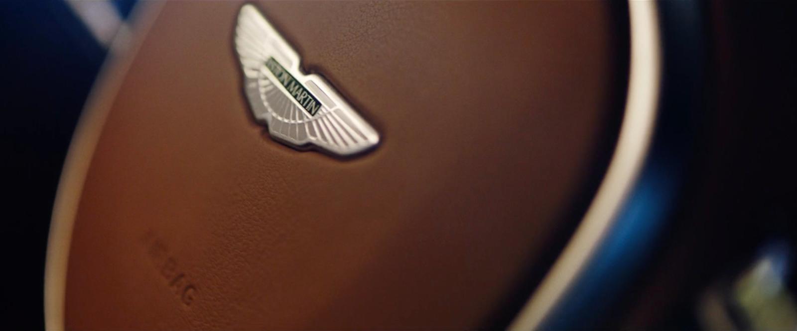 a close up of a steering wheel with a sticker on it
