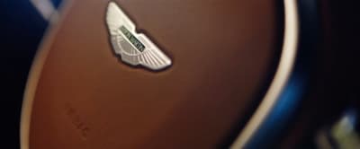 a close up of a steering wheel with a sticker on it
