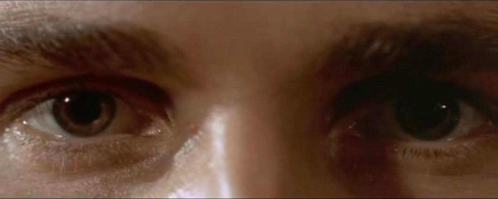 a close up of a person's eyes with a blurry background