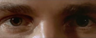 a close up of a person's eyes with a blurry background