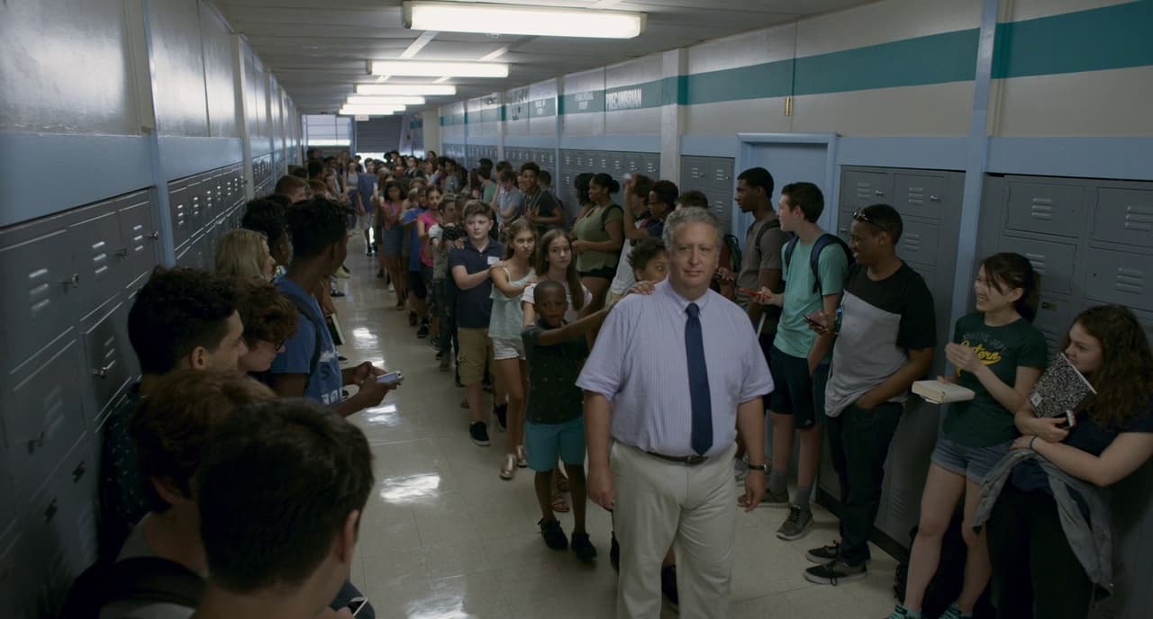 a large group of people standing in a hallway