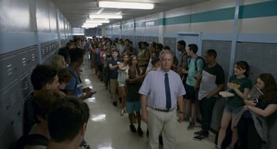 a large group of people standing in a hallway