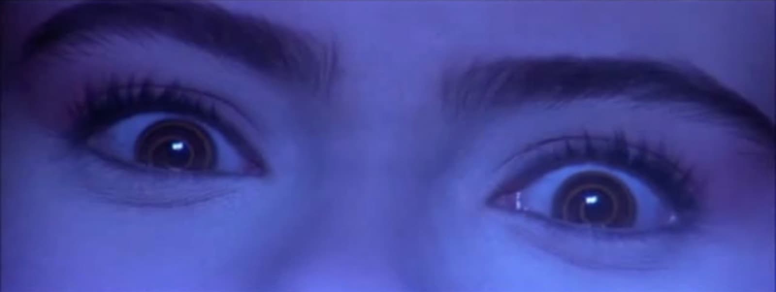 a close up of a person's eyes with long lashes