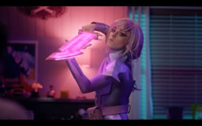 a woman in a purple outfit holding a pink light
