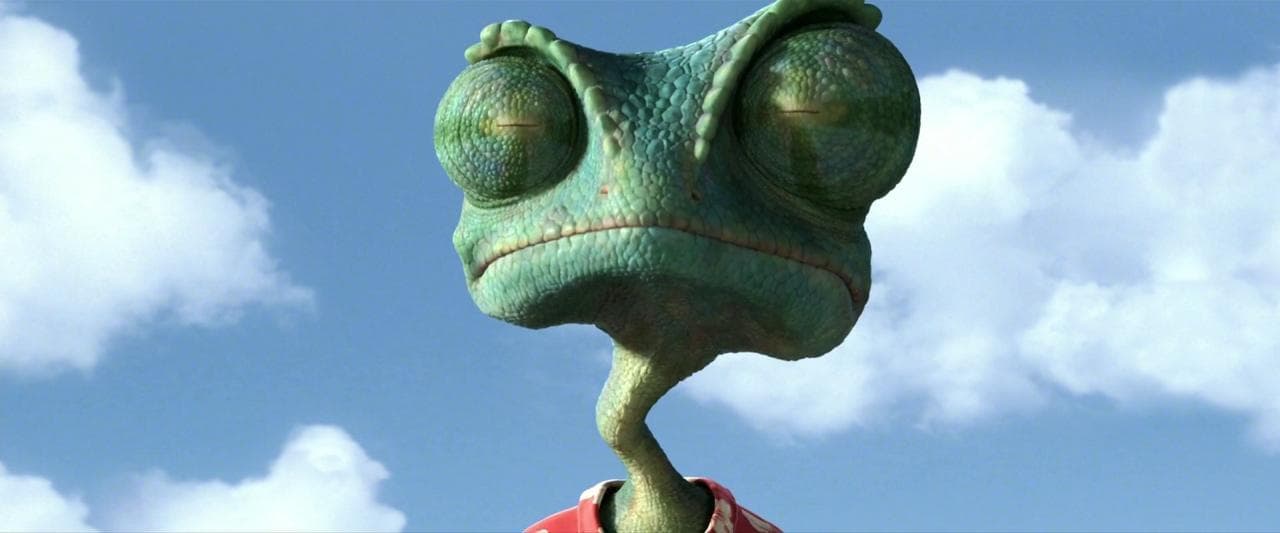 a very cute looking green creature with big eyes